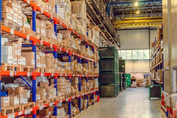 Background cardboard boxes inside warehouse. Logistics center. The composition filled with cardboard boxes